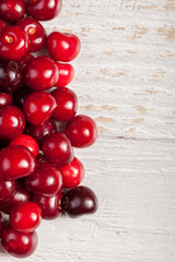 Fresh cherries on wooden table