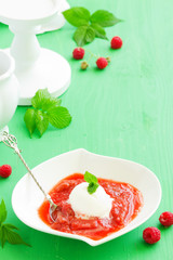 Scoop of ice cream with rhubarb compote.