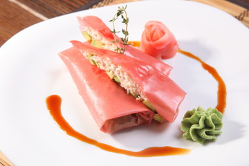 Oriental-style rolls with wasabi sauce