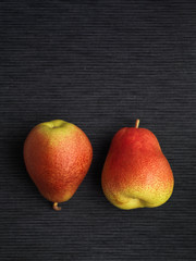 Two pears on a dark background