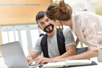 Trendy business people working on project