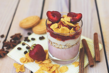 yogurt with strawberries and corn flakes