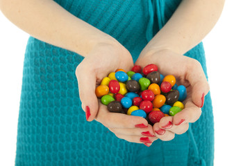 Colorful candy in hands