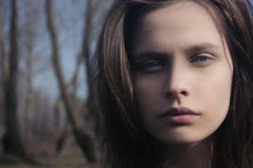 Portrait of a young girl on the nature