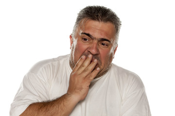 Disgusted man on white background