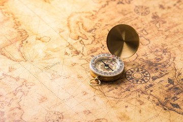 Fototapeta na wymiar Compass on vintage map.