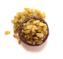 Raisins wooden basket on a White background