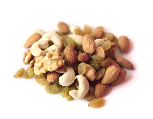Mix of dry nuts and fruits close-up with wooden basket