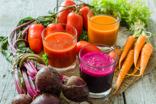 Selection of vegetable juices in glasses and ingredients