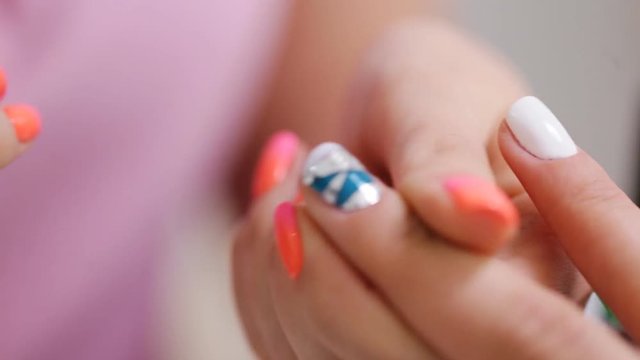 Female hands manicure close up view. Delicate spring manicure.