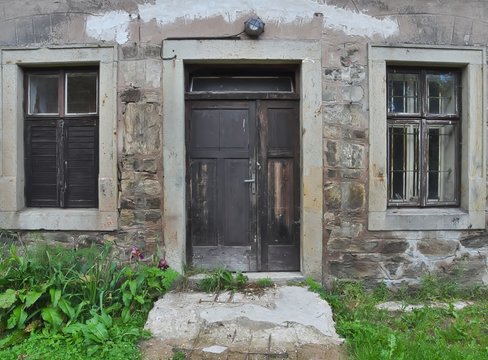 Frontal view of old wooden doors and windows