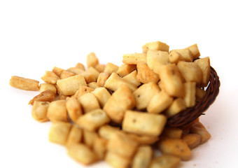 A pile of salted mixed snacks, namak pare, background.