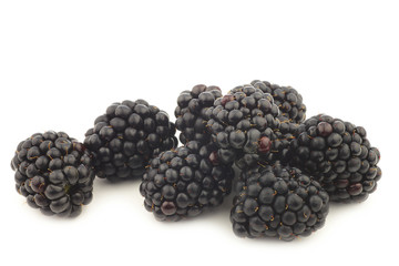 bunch of fresh blackberries on a white background