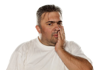Obraz premium sad man has a toothache