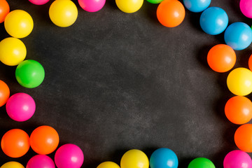Fototapeta na wymiar Chalkboard and colorfull plastic balls