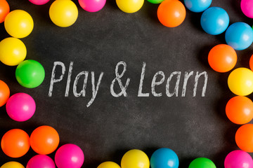 Play and learn text on the chalkboard