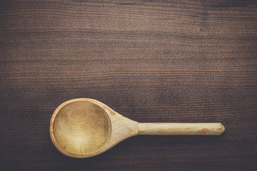 old wooden spoon on the blue table