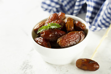 Dates in white bowl