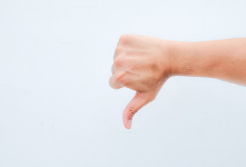 hand thumb down on white background