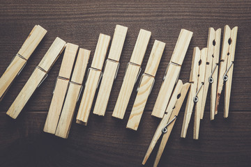 wooden clothes pegs on the brown table