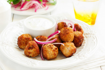 Homemade meatballs with cream sauce.