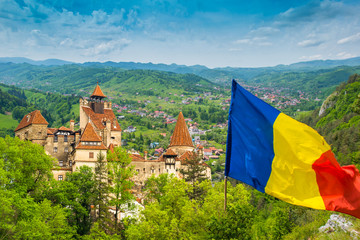 Panoramic view over the medieval architecture of famous Bran castle and the surroundings - Romania