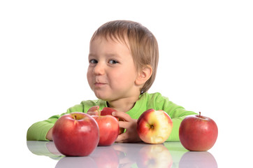Fototapeta na wymiar Cute child with red apples on white background