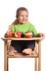Fototapeta premium Cute child with red apples on white background