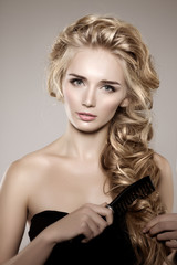 Naklejka premium Model with long braided hair. Waves Curls Braid Hairstyle. Hair
