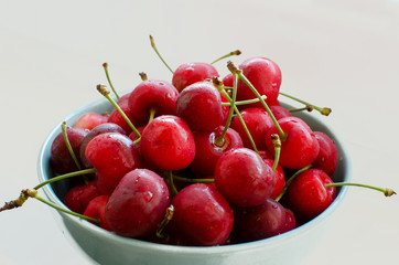 Cherry on the plate  on the white background