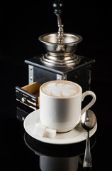 coffee grinder, cup of coffee