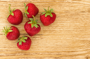 Fresh strawberry  on the wooden  background. 
