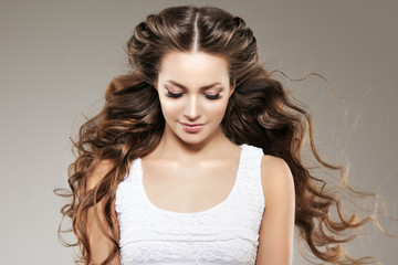 Model with long hair. Waves Curls Hairstyle. Hair Salon. Updo. F