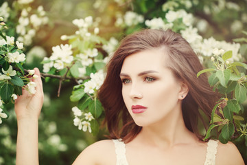 Healthy Beauty. Portrait of Beautiful Young Woman on Floral Back