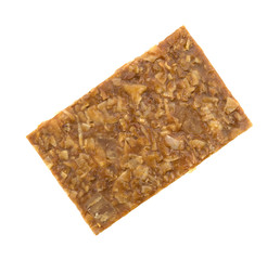 Ginger brittle bar on a white background top view.