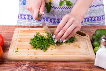 the girl cuts greens
