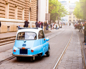 Fototapeta premium Veteran car street cruise on public roads. rear view