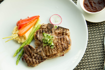  pork chop on a white plate