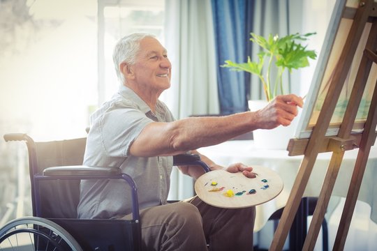 Senior Man Painting At Home