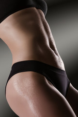 Female sexy body in black underwear.  Woman body care.