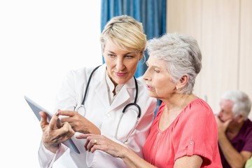 Nurse talking to a senior woman