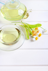 teapot and cup herbal tea wood background
