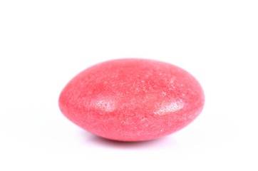 Isolated red colored smarties on white background
