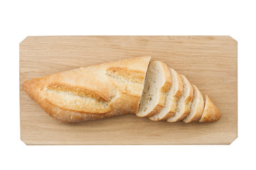  White small bread being cut on wooden board