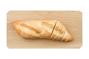  White small bread being cut on wooden board