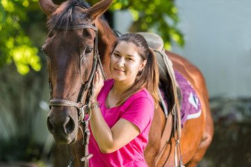 Obraz premium Beautiful girl with a horse