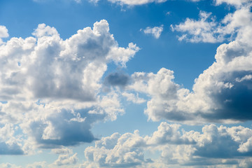 Fototapeta na wymiar White Cumulus Clouds On Blue Sky