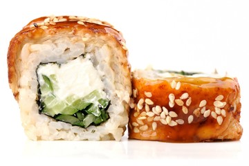 Sushi rolls with cream cheese, nori and cucumber covered with ee