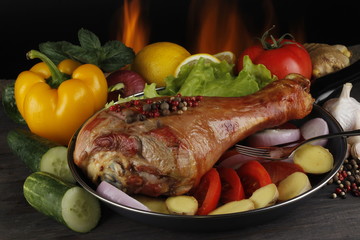 hen with vegetables on wooden background