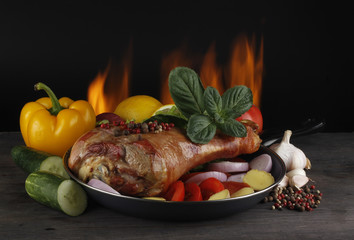 hen with vegetables on wooden background